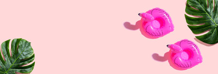 Summer concept with pink flamingo floatsの写真素材