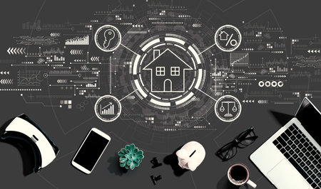 Real estate theme with electronic gadgets and office suppliesの写真素材