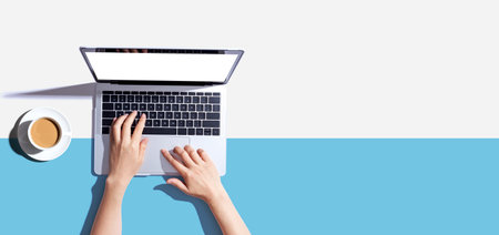 Person using a laptop computerの写真素材