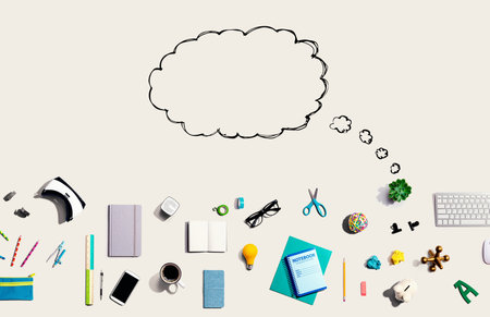 Blank speech bubble with electronic gadgets and office suppliesの写真素材