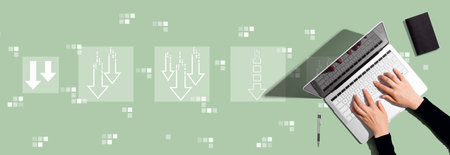 Descending arrows with person using laptop computerの写真素材