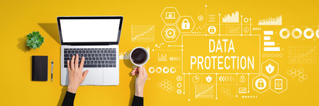 Data protection theme with person using laptop computerの写真素材
