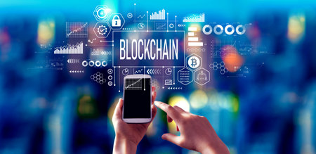 Blockchain theme with person using a smartphone at nightの写真素材