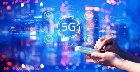 5G network with person using a smartphone at nightの写真素材