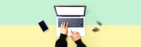 Person using a laptop computerの写真素材