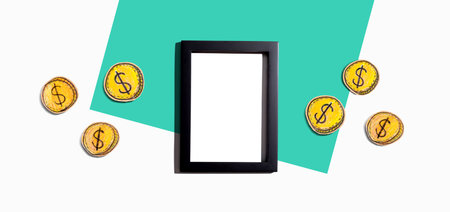 Blank photo frame with coins - earn online themeの写真素材