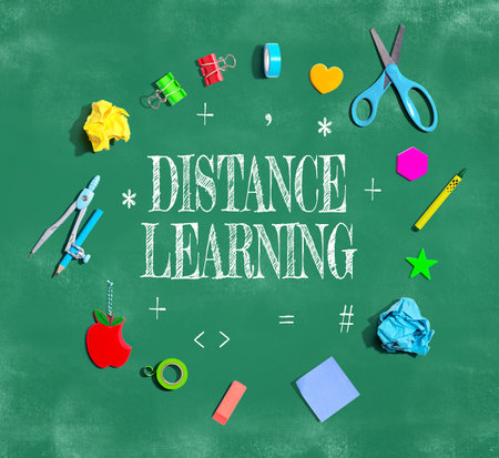 Distance Learning theme with school supplies on a chalkboardの写真素材