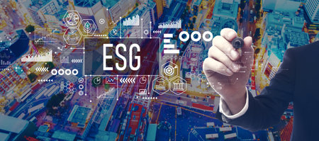 ESG theme with businessman in city at nightの写真素材