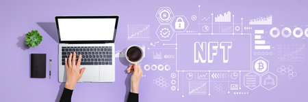 NFT theme with person using laptop computerの写真素材