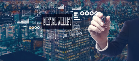 Digital Wallet theme with businessman in city at nightの写真素材