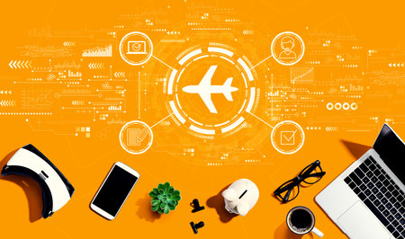 Flight ticket booking concept with electronic gadgets and office suppliesの写真素材