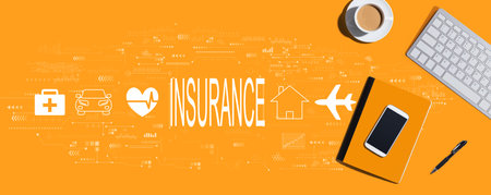 Insurance concept with computer keyboard and office itemsの写真素材