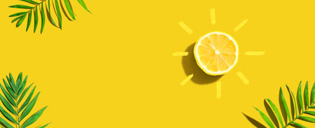 Summer concept with lemon sunlight with palm leavesの写真素材