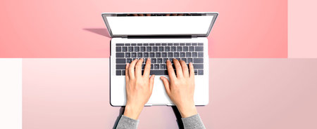 Person using a laptop computerの写真素材