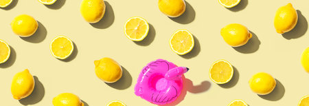 Summer concept with a pink flamingo float and lemonsの写真素材