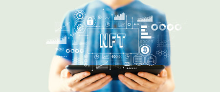 NFT theme with man using a tabletの写真素材