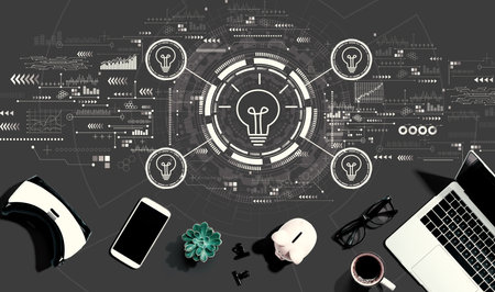 Idea light bulb theme with electronic gadgets and office suppliesの写真素材