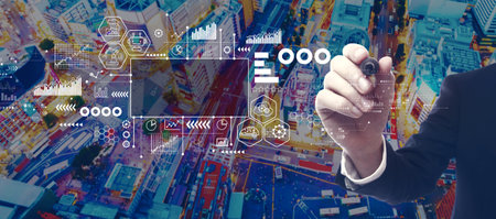 Industry 4.0 theme with businessman in city at nightの写真素材