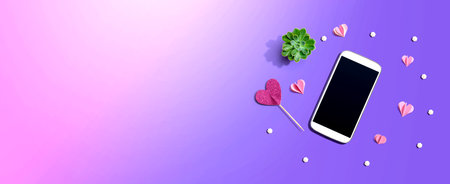 Smartphone with hearts and a succulentの写真素材