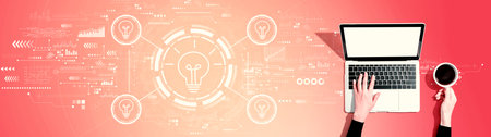 Idea light bulb theme with person using a laptopの写真素材