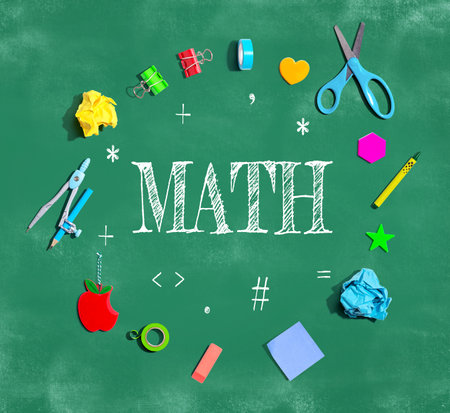 Math theme with school supplies on a chalkboardの写真素材