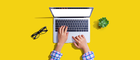Person using a laptop computerの写真素材