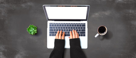 Person using a laptop computerの写真素材