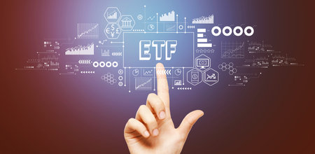 ETF theme with hand pressing a buttonの写真素材