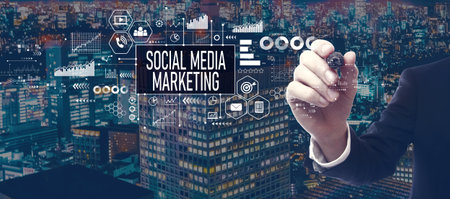 Social media marketing theme with businessman in city at nightの写真素材