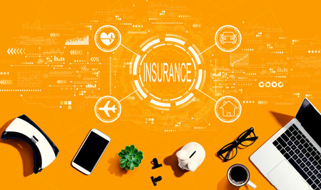 Insurance concept with electronic gadgets and office suppliesの写真素材