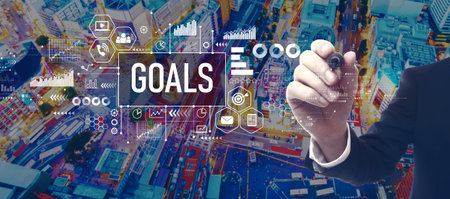 Goal theme with businessman in city at nightの写真素材