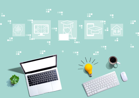 Distance learning theme with computers with a light bulbの写真素材