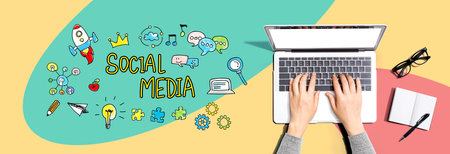 Social media with person using a laptopの写真素材