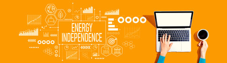 Energy Independence concept with person using a laptopの写真素材