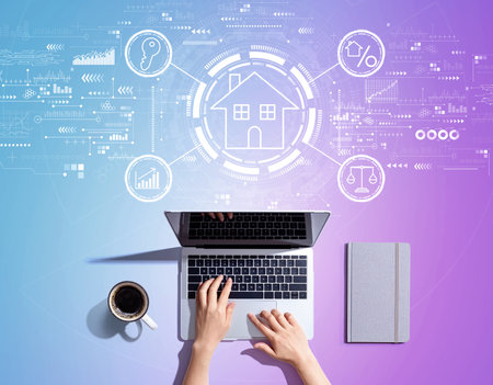 Real estate theme with person using a laptopの写真素材