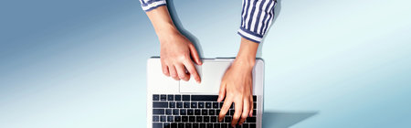 Person using a laptop computerの写真素材