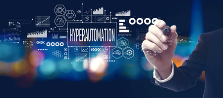 Hyperautomation theme with businessman at nightの写真素材