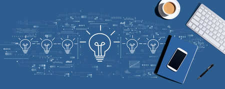 Idea light bulb theme with computer keyboard and office itemsの写真素材