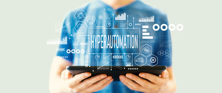 Hyperautomation theme with man using a tabletの写真素材