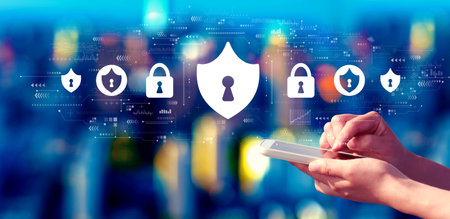 Cyber security theme with person using a smartphone at night