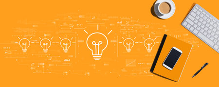 Idea light bulb theme with computer keyboard and office itemsの写真素材