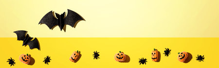 Halloween paper bats and small pumpkin ghostsの写真素材