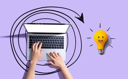 Creativity, inspiration, idea concept with light bulb and laptop computerの写真素材