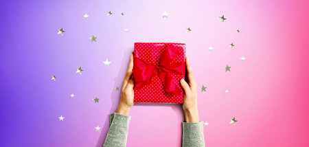 Person holding a gift boxの写真素材