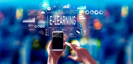 E-Learning theme with person using a smartphone at nightの写真素材