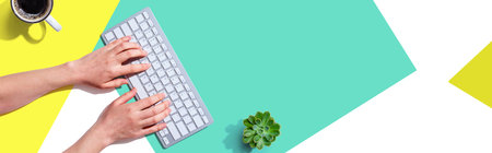 Woman using a computer keyboardの写真素材