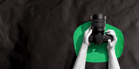 Person holding a SLR camera