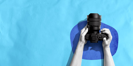 Person holding a SLR cameraの写真素材