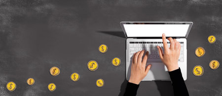 Person using a laptop with hand drawn coinsの写真素材