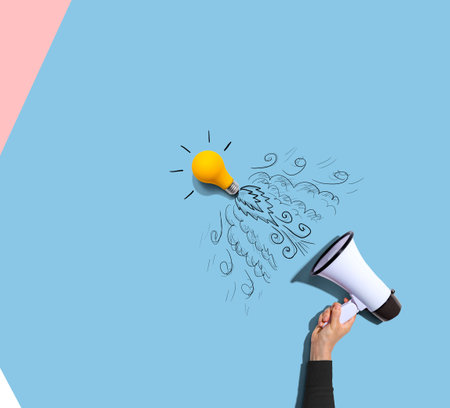 Attention and announcement concept with an idea light bulb flying to the sky like a rocketの写真素材